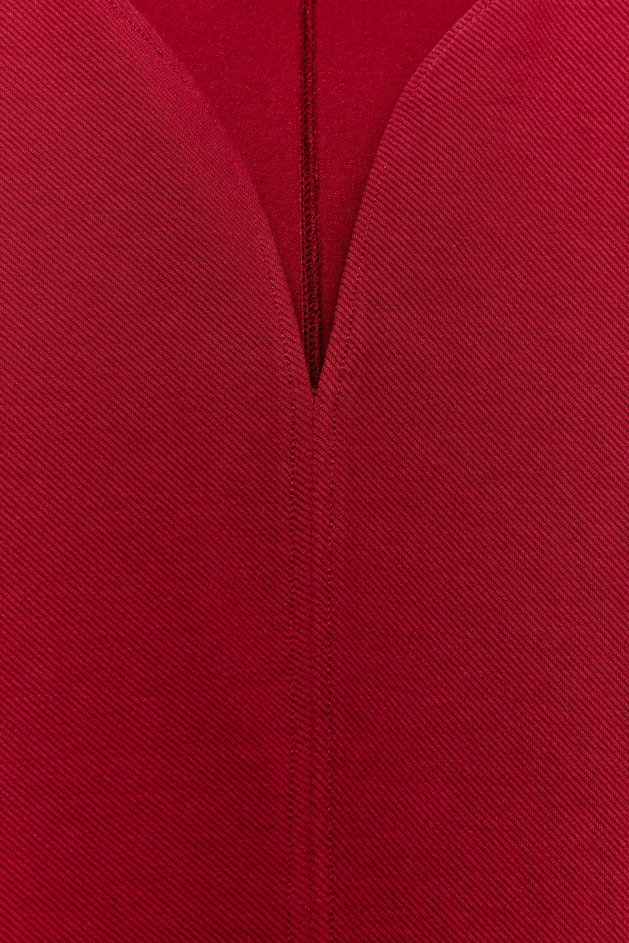 TOP PÉPLUM À MANCHES BOUFFANTES